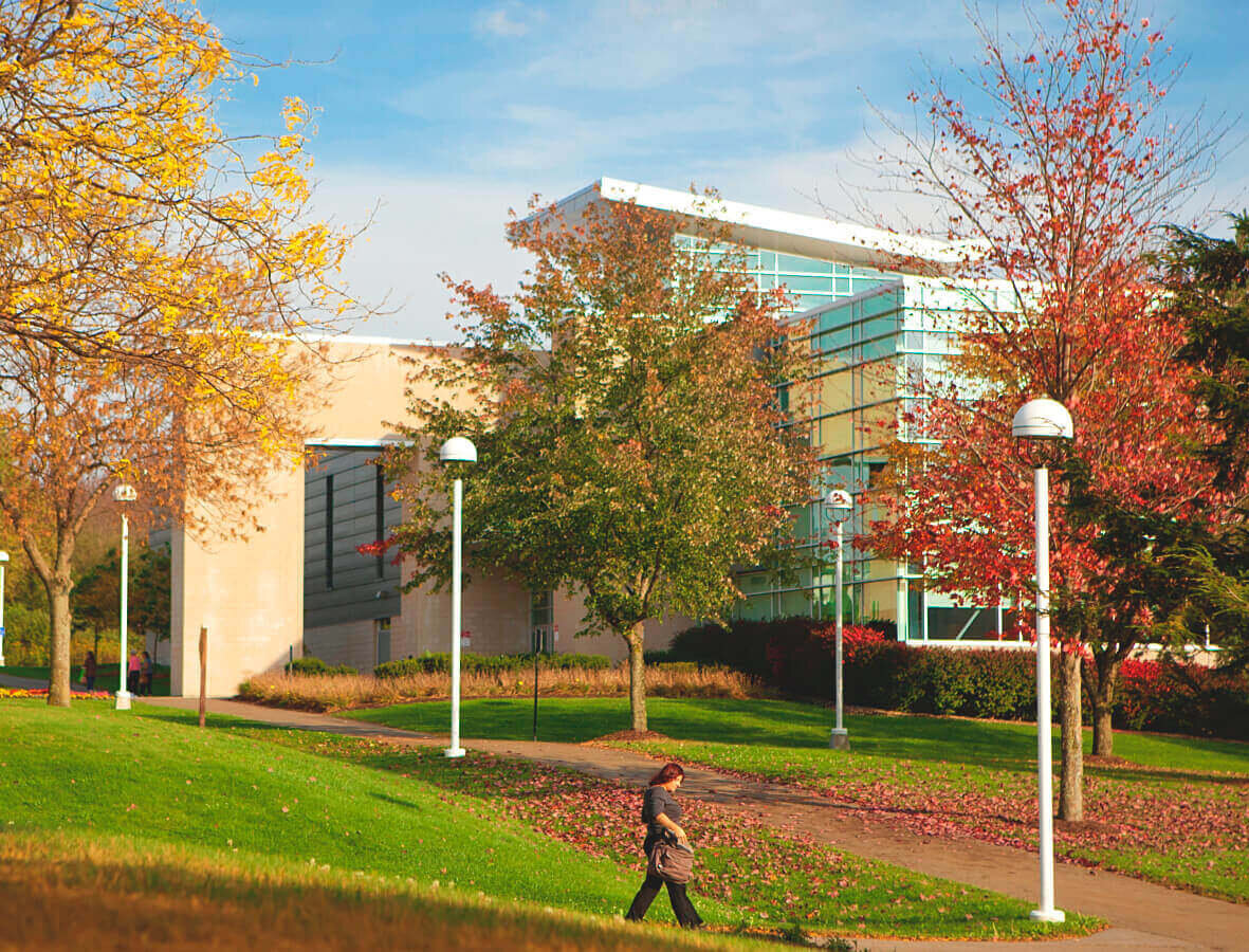 SUNY Broome Community College students walking outside near the campus.