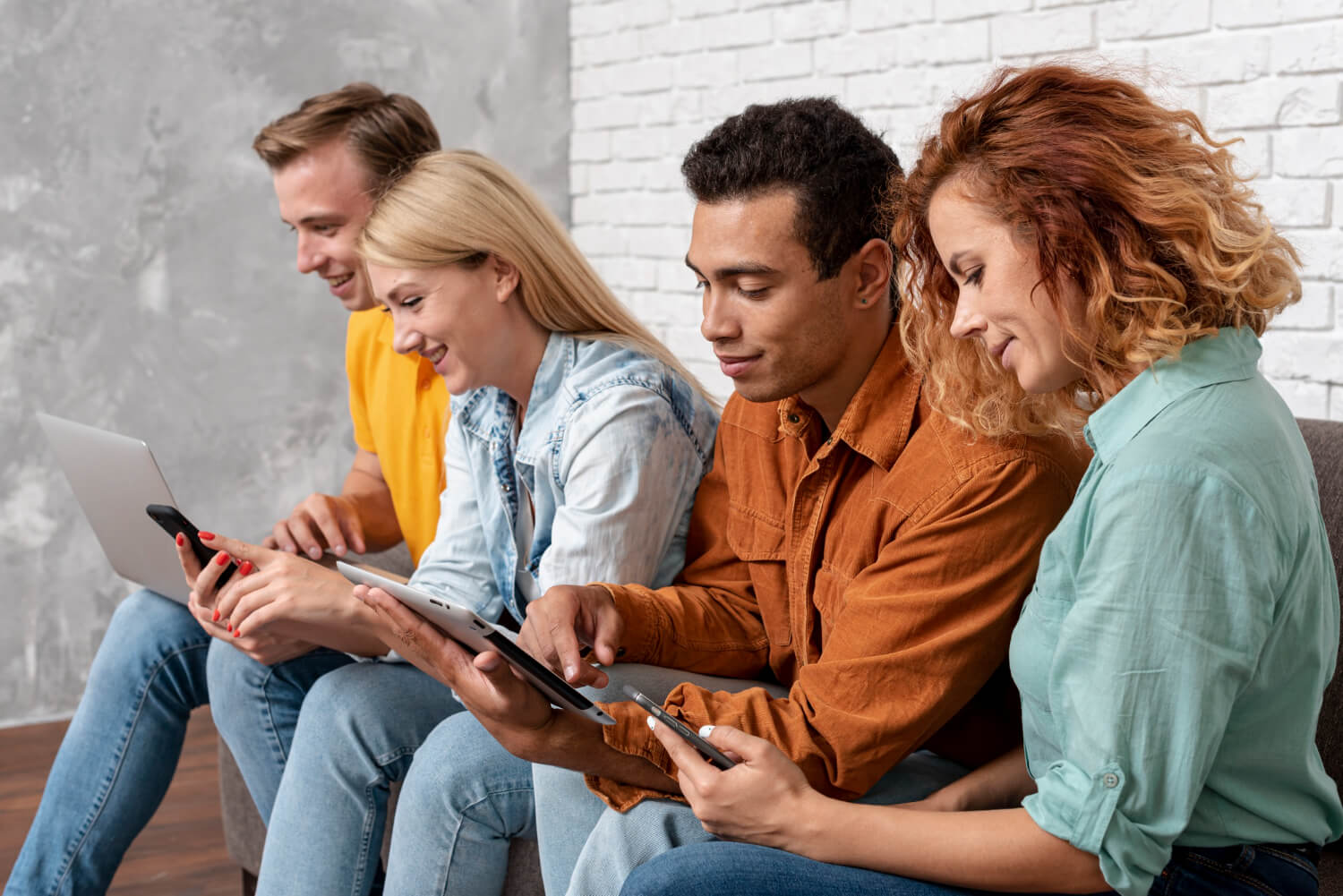 Smiling friends using phone while sitting at home          .