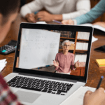 A student watching a laptop