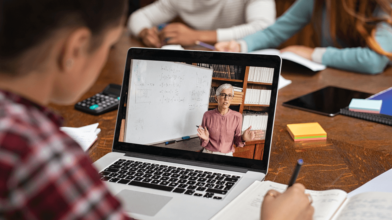 A student watching a laptop